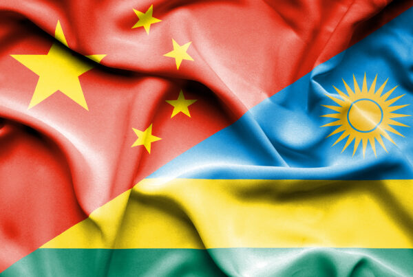 Waving flag of Rwanda and china